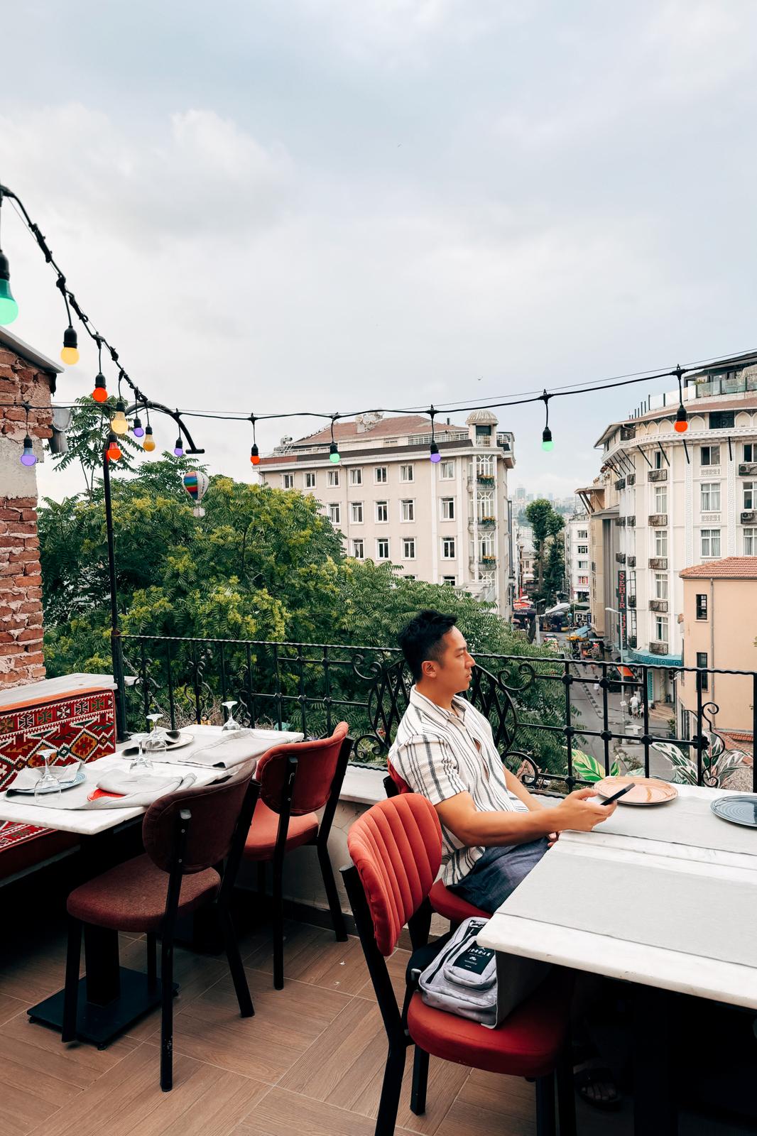 Christian on a rooftop terrace overlooking Istanbul
